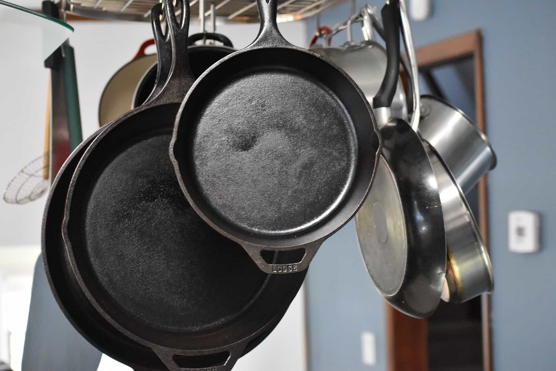 Hanging stainless steel and cast iron pans.