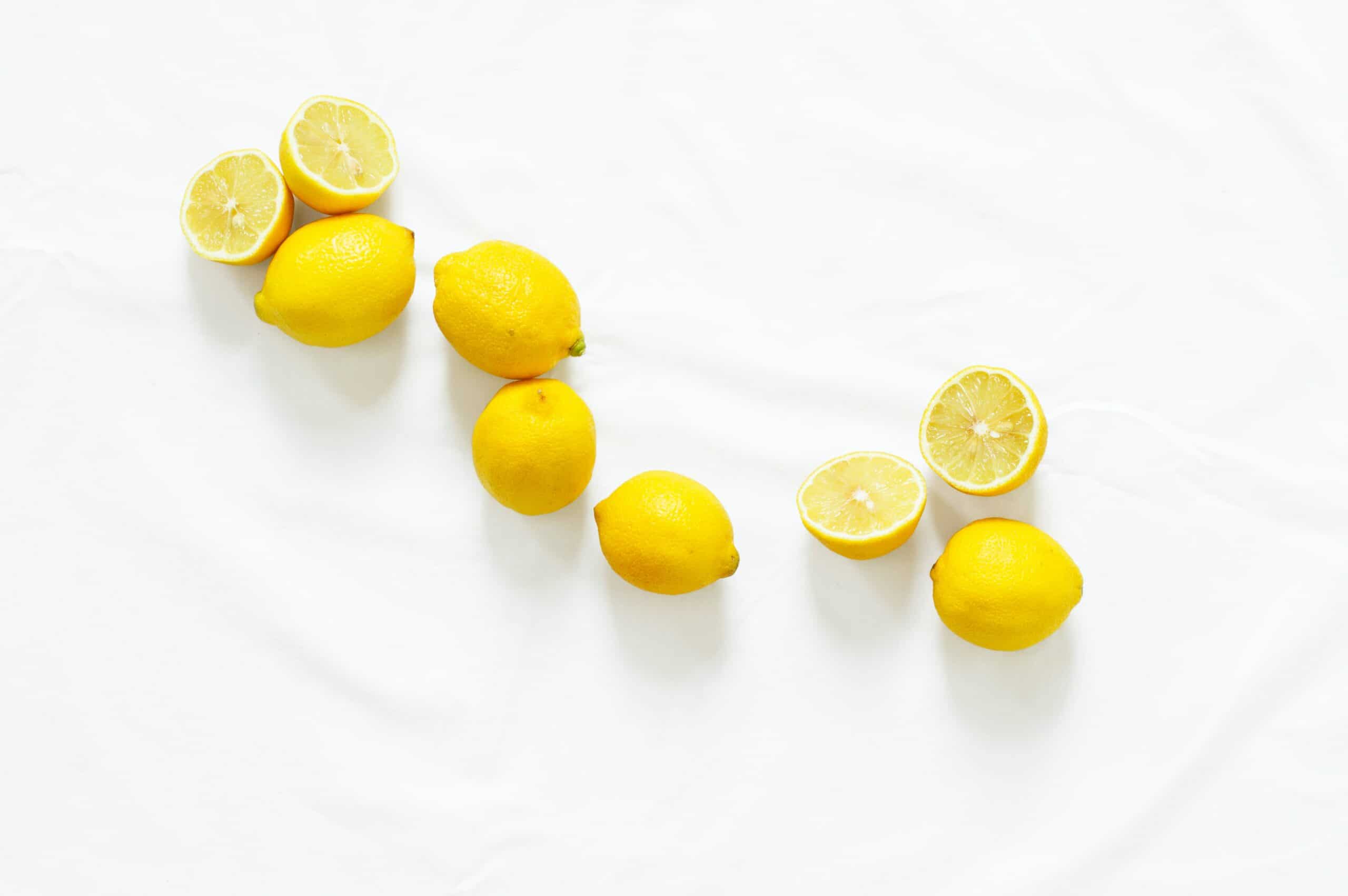 Collection of whole and sliced lemons.