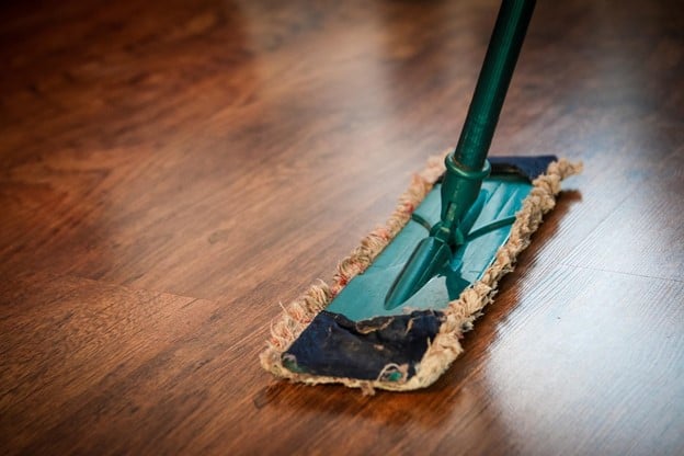 Microfiber mop on hardwood floor.