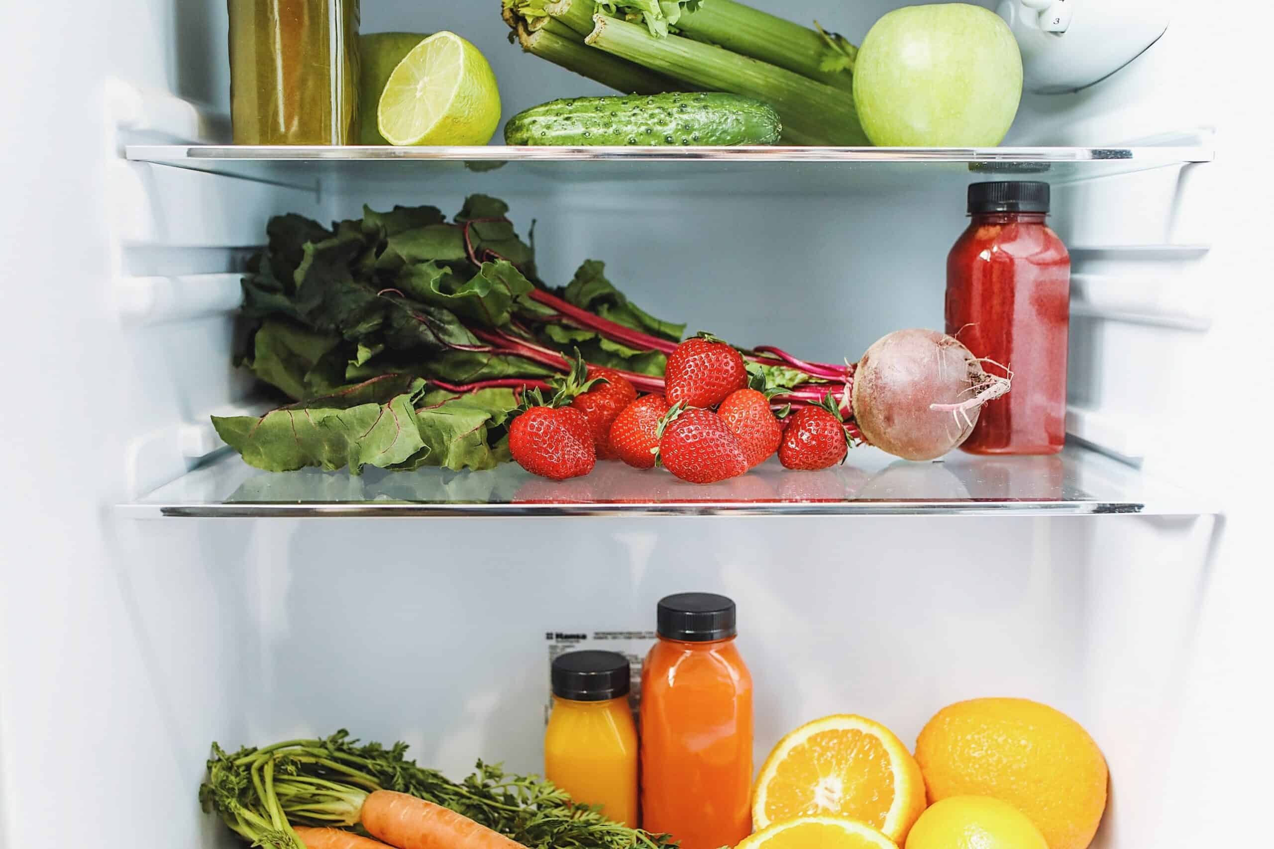 Refrigerator full of vegetables and fruits.