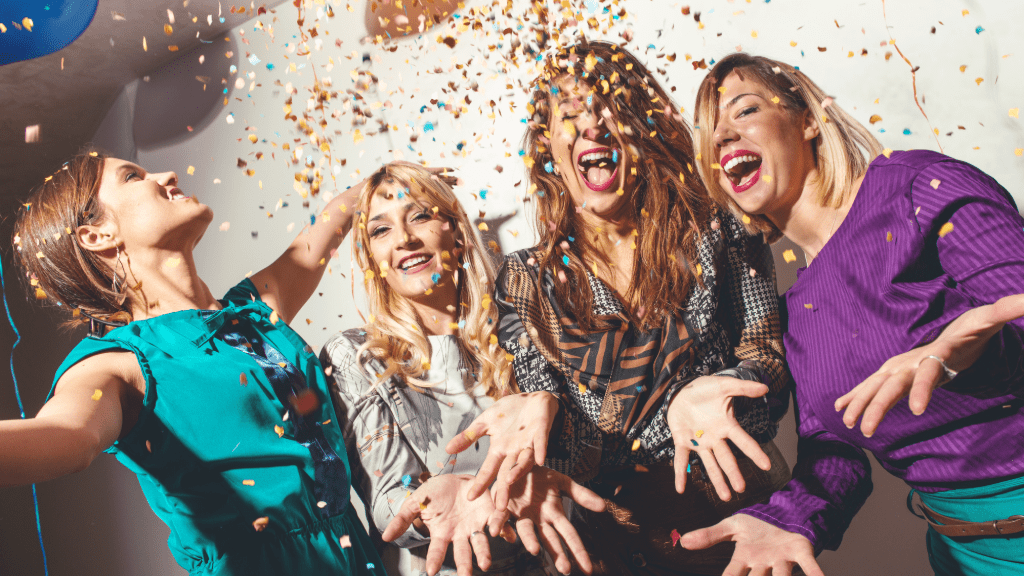 Women partying with confetti.
