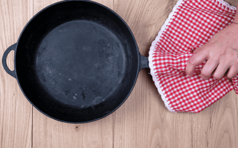 How to clean black residue off cast iron skillet.